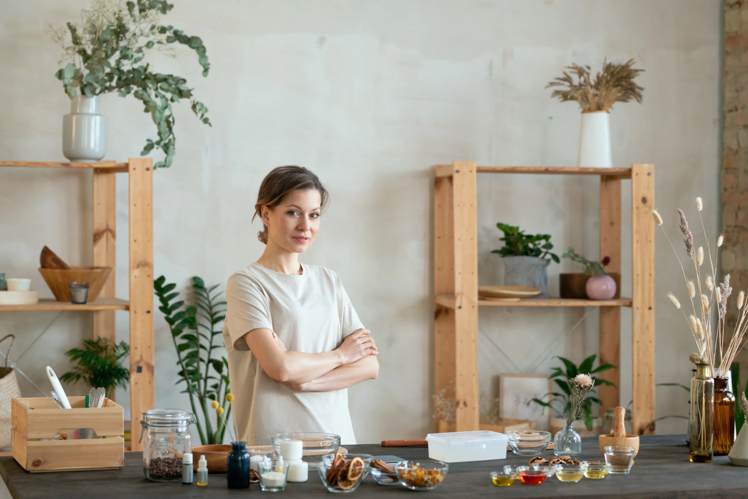 woman-standing-by-table-with-ingredients-for-makin